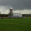 Storm clouds looming over
a barn & silo.
Near Tingwick, Quebec.