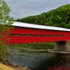 Burgandy-red covered bridge over the Riviere Matapedia-Mann Settlement, Quebec