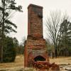 Some red-brick chimney remains of the Sabine Farms rectory.